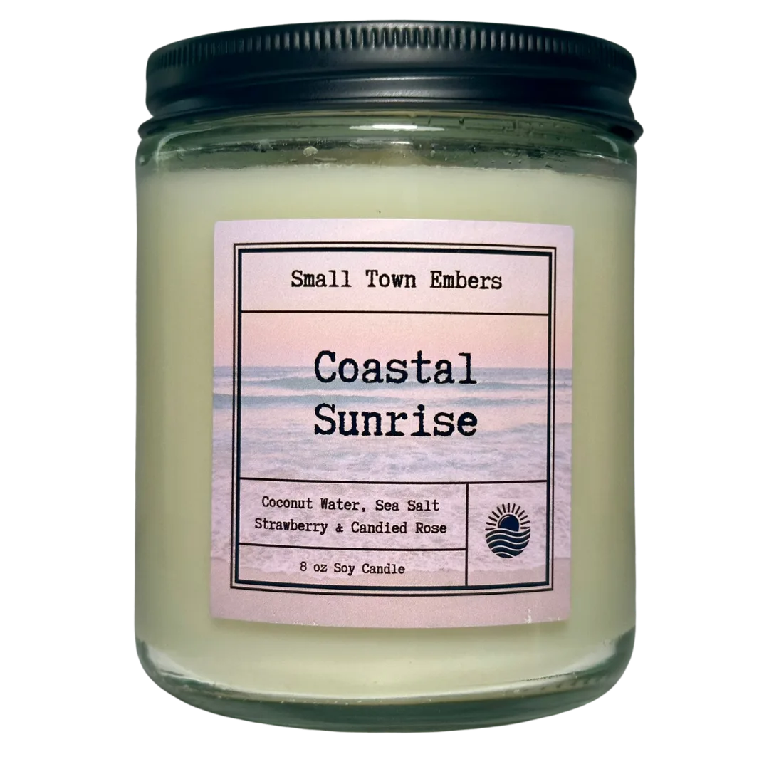 a picture of a coastal sunrise scented 8 oz soy wax candle